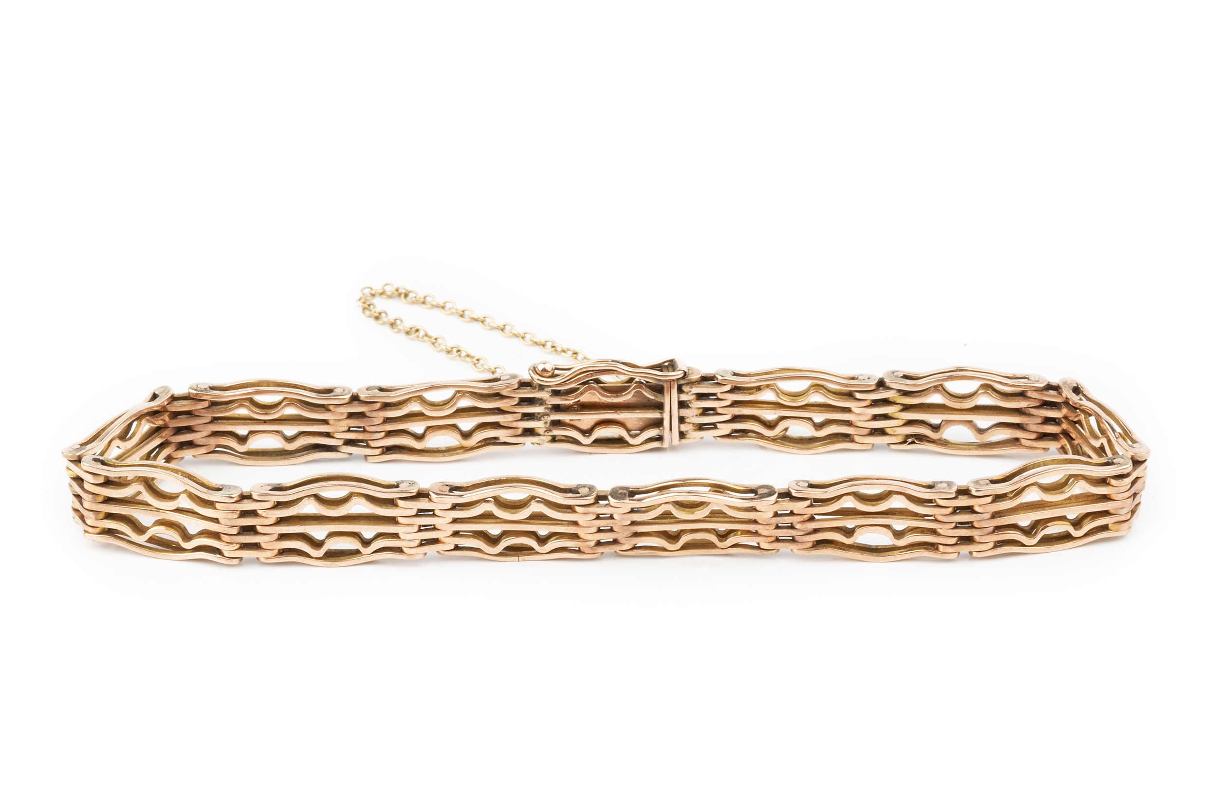 A 9ct gold gatelink bracelet, the links of shaped and wavy rectangular design, 19cm long approx