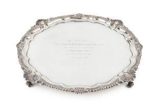 An Edwardian silver salver, the shaped and gadrooned border with foliate and scallop decoration,