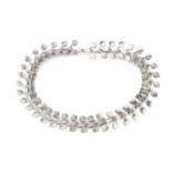 A Swedish silver choker necklace, composed of interlocking stylised twin leaf motif links, maker's