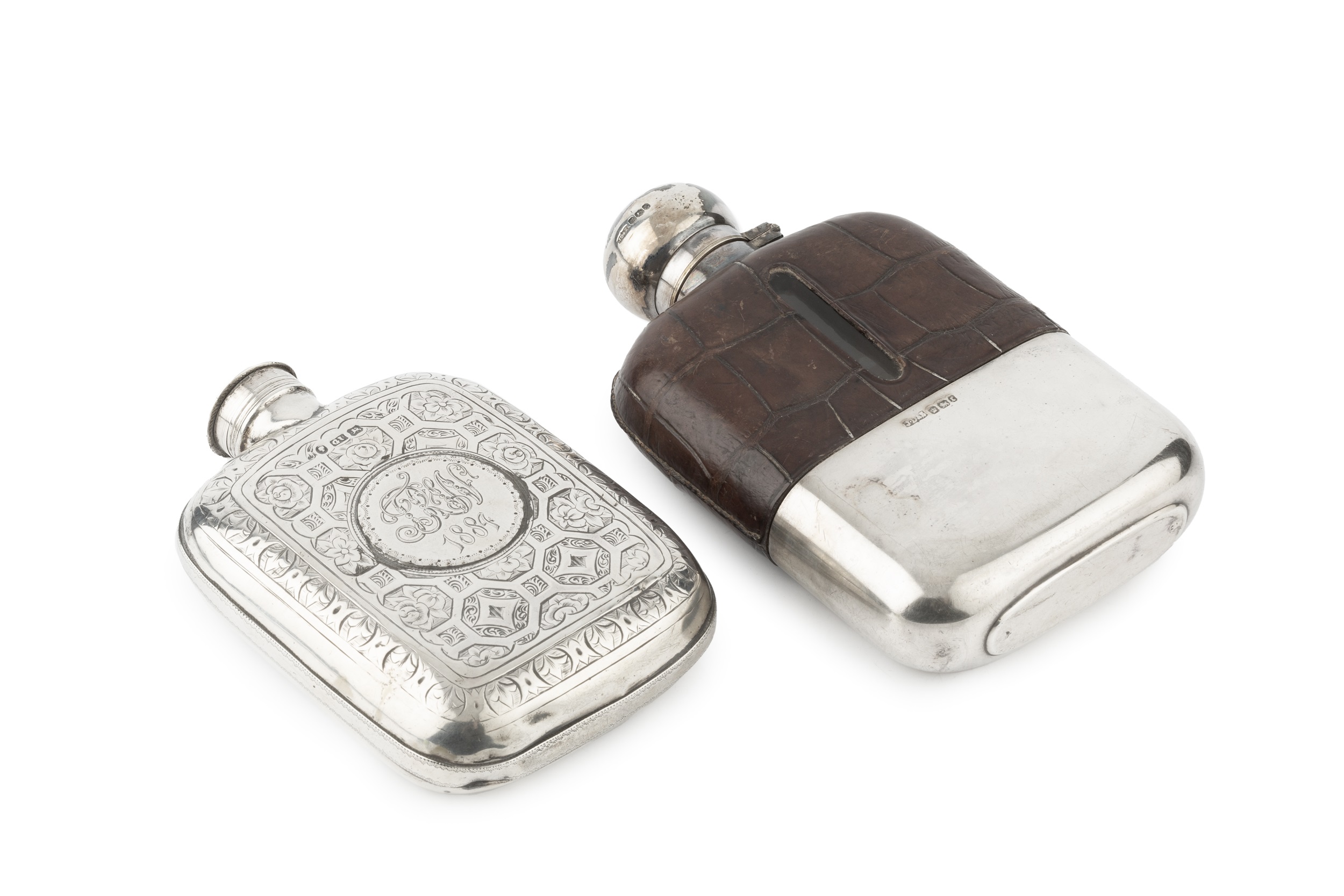 A mid Victorian silver hip flask, of curved and rounded form, engraved with stylised foliage and