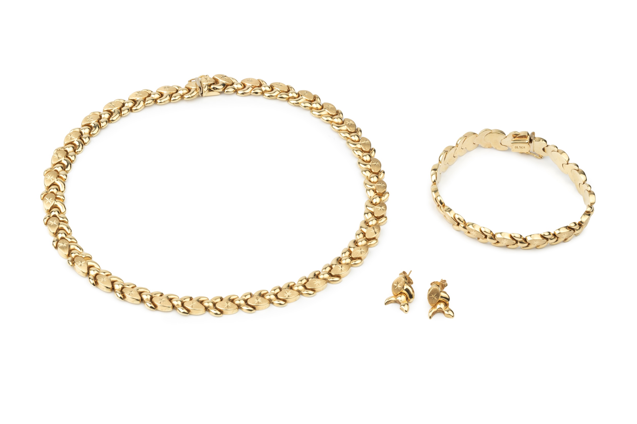 A 14k gold necklace, composed of shaped interlocking links and engraved with stars, 39.5cm long,