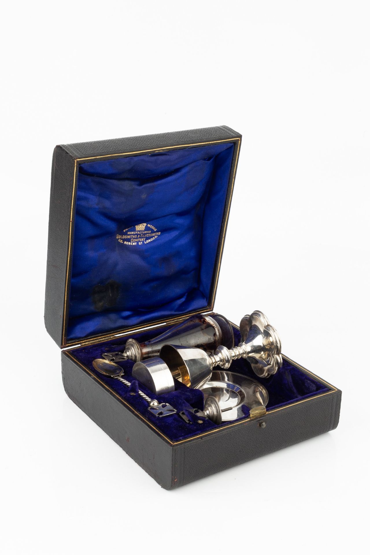 A late Victorian silver travelling communion set, comprising chalice, paton, wafer box, spoon and