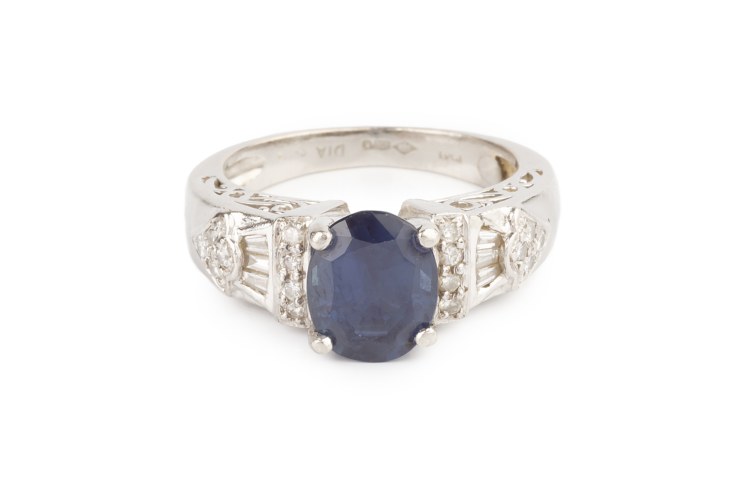 A sapphire and diamond dress ring, the oval mixed-cut sapphire claw set between graduating shoulders - Image 2 of 4