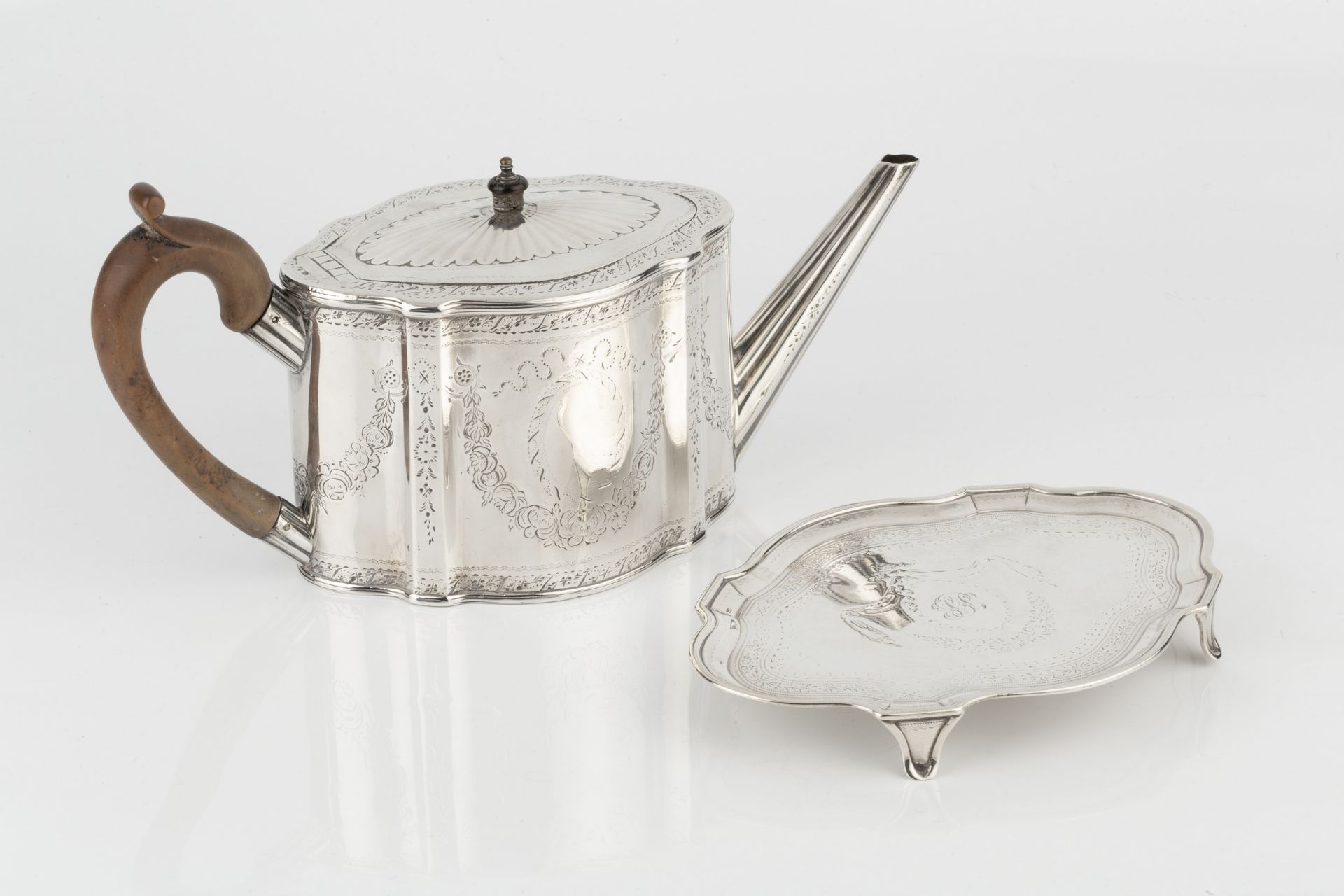 A George III silver teapot, of shaped oval outline, bright-cut with garlands of flowers and having - Image 3 of 4