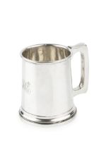 A George V silver pint tankard, of plain design with shaped handle, engraved initials, by William