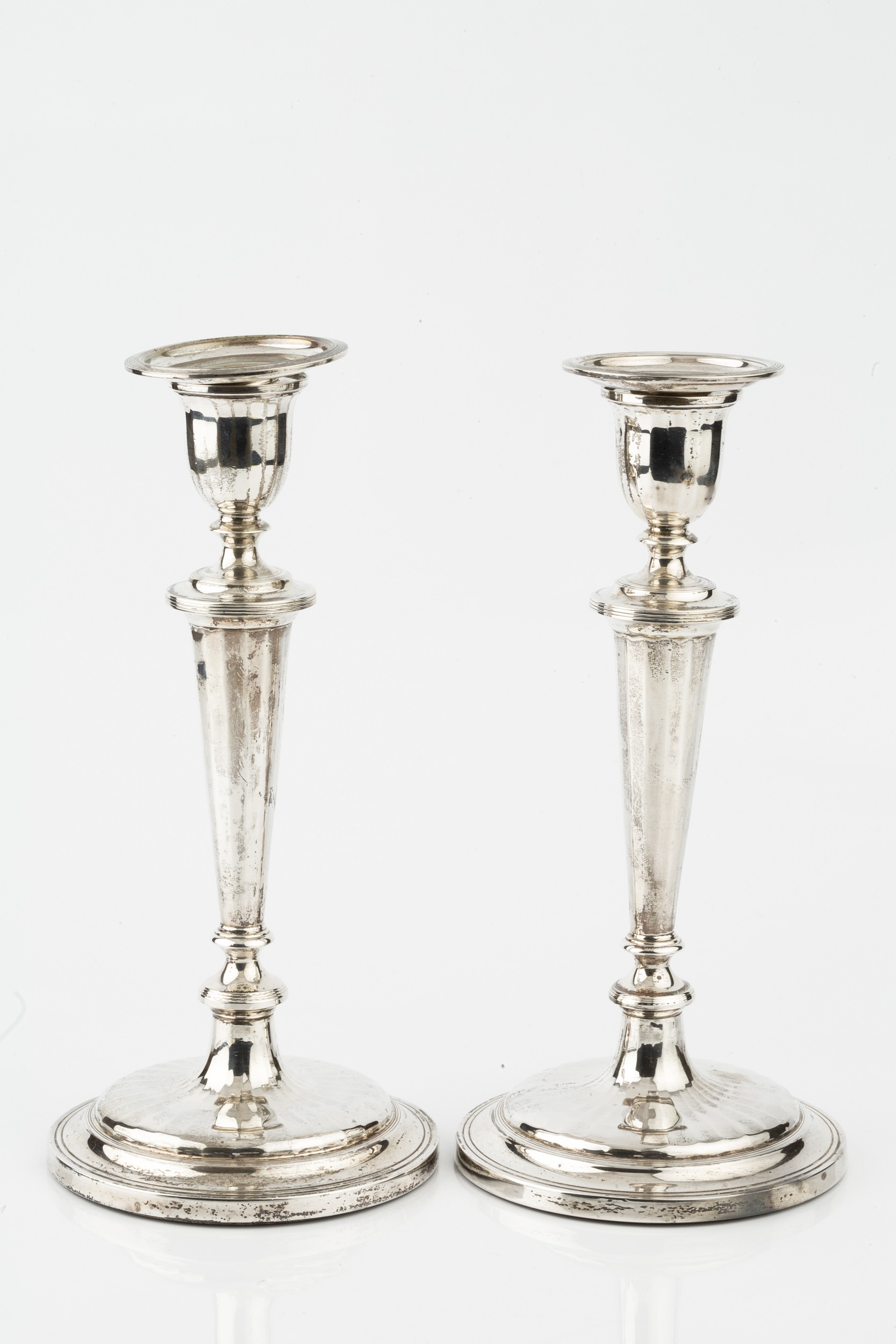 A pair of silver candlesticks, with reeded borders and knopped faceted stems, on circular weighted - Image 2 of 3