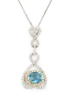 An 18ct white gold, diamond and blue topaz pendant, the oval checkerboard cut topaz within a