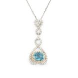 An 18ct white gold, diamond and blue topaz pendant, the oval checkerboard cut topaz within a