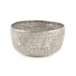 A Burmese white metal thabeik bowl, embossed and engraved with numerous animals and stylised foliage