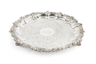 A George IV Scottish silver salver, with shaped scallop and foliate scroll cast border, engraved