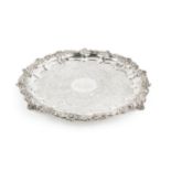 A George IV Scottish silver salver, with shaped scallop and foliate scroll cast border, engraved