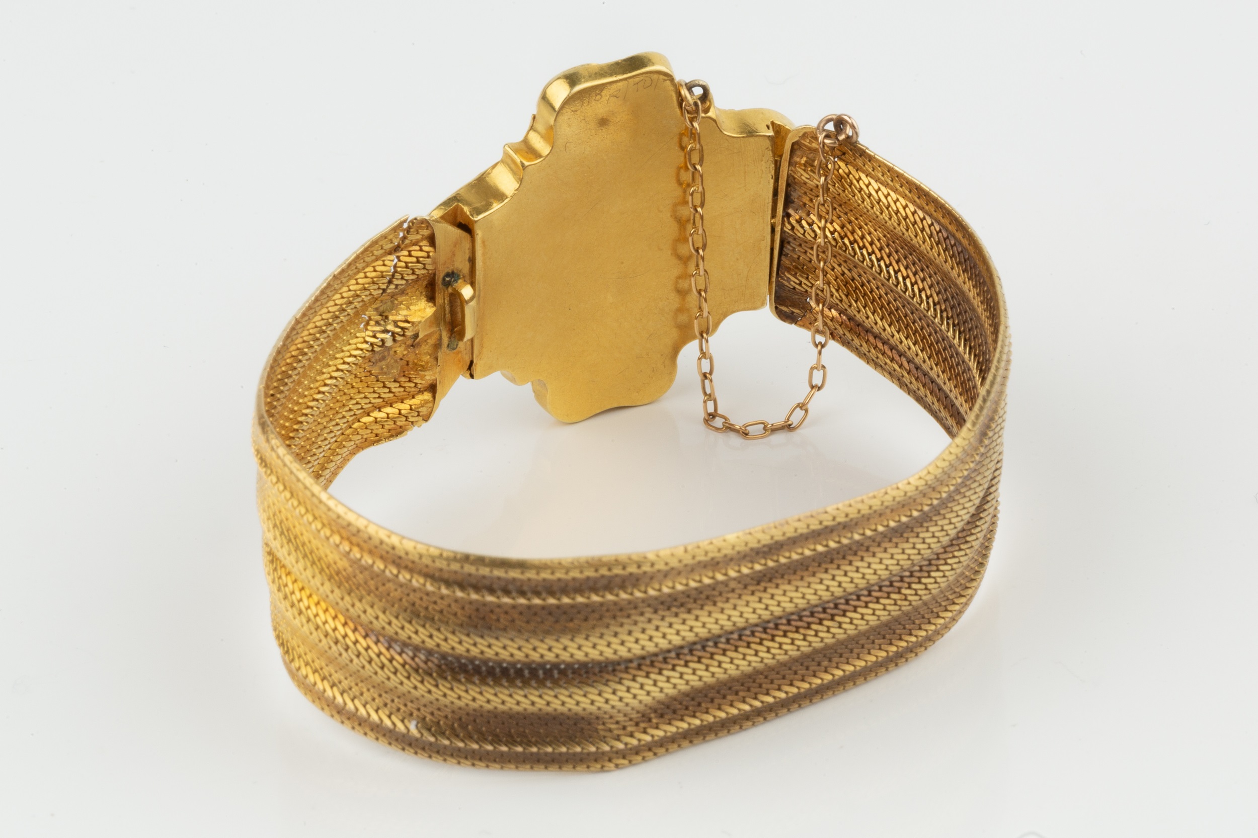 A yellow precious metal bracelet, of woven mesh strap form, the quatrefoil shaped clasp relief - Image 2 of 2