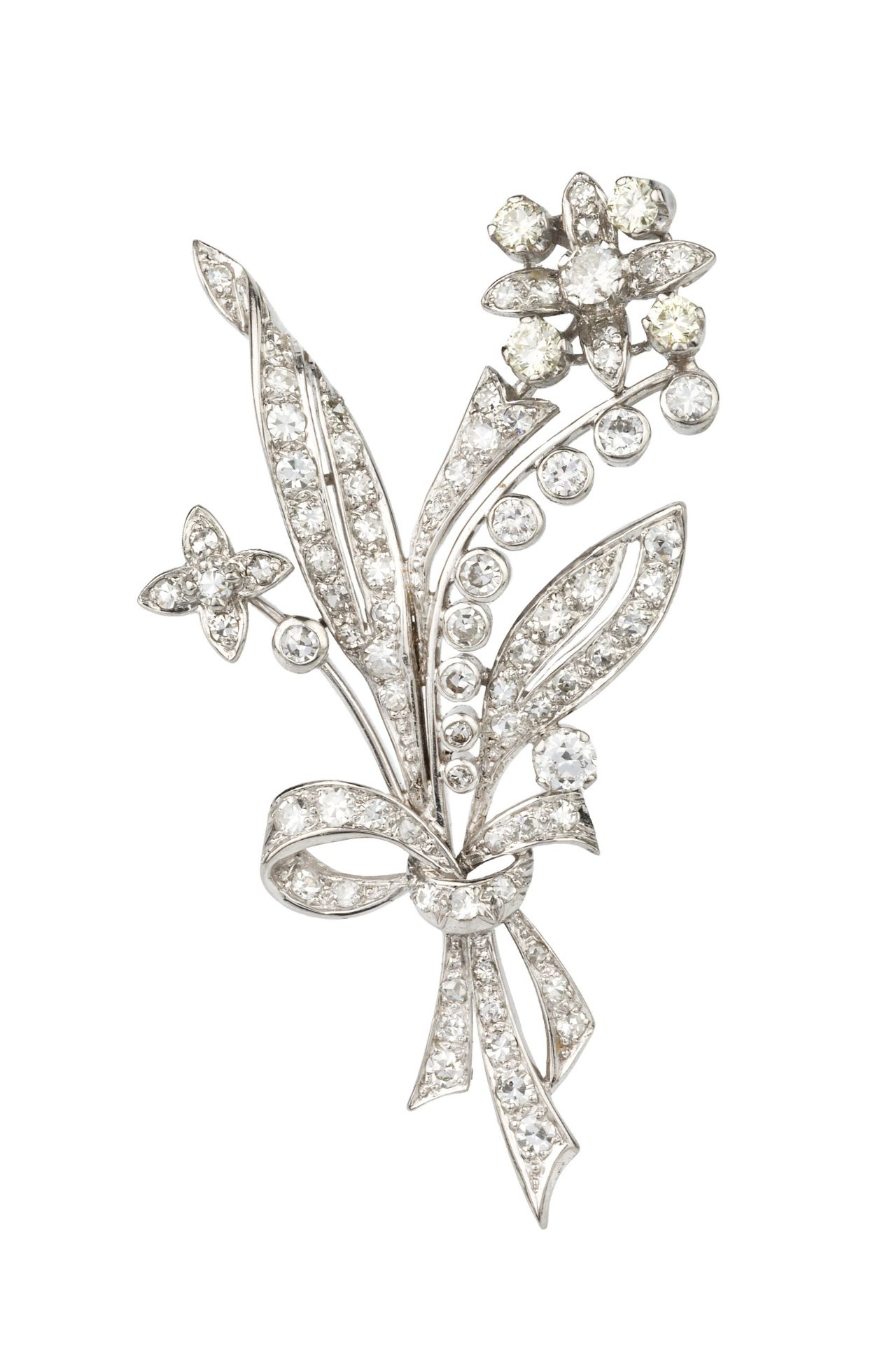 A diamond spray brooch, in the form of ribbon tied flowers and leaves, the main flower head set with