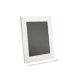 A silver rectangular photograph frame by Tiffany & Co, of plain design with easel back, 23cm high,