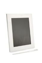 A silver rectangular photograph frame by Tiffany & Co, of plain design with easel back, 23cm high,