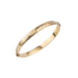 A 9ct gold hinged bangle, with foliate engraved decoration, 6.5cm wide approx weight 17.8g