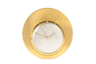 A Jaeger-LeCoultre gold plated circular travel timepiece, with circular silvered dial, and