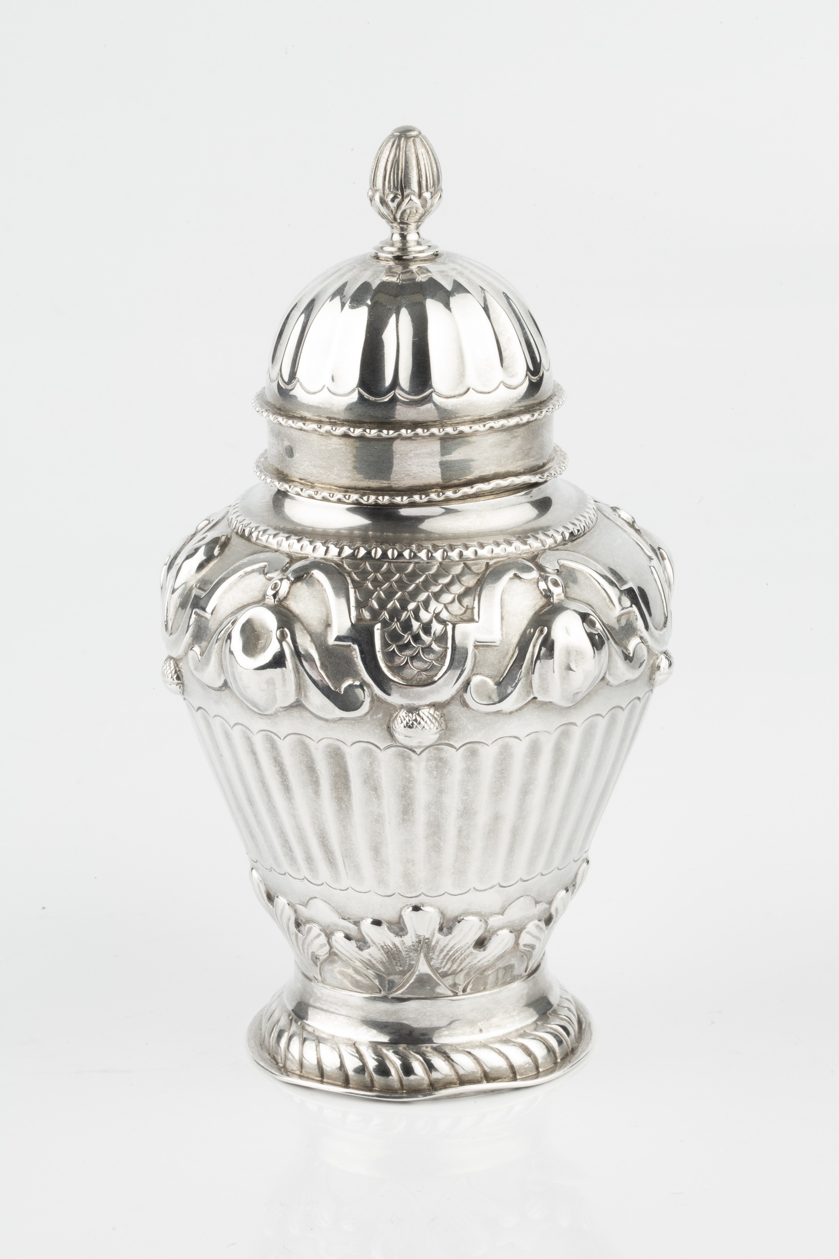 A late Victorian silver tea caddy and cover, of baluster urn form, embossed with repeated stylised - Image 3 of 3