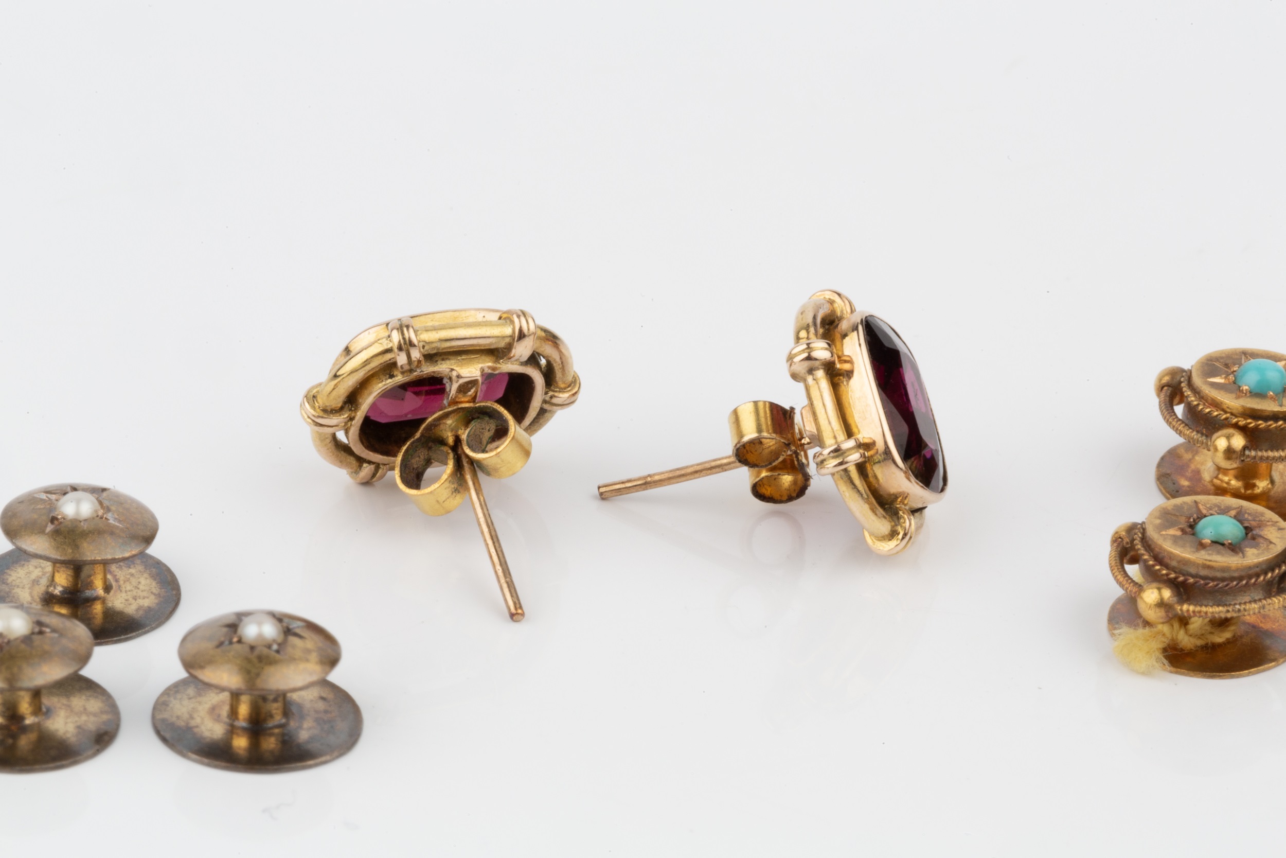 A pair of garnet ear studs, in unmarked yellow metal mounts, 1.2cm, a set of three 15ct gold - Image 2 of 2