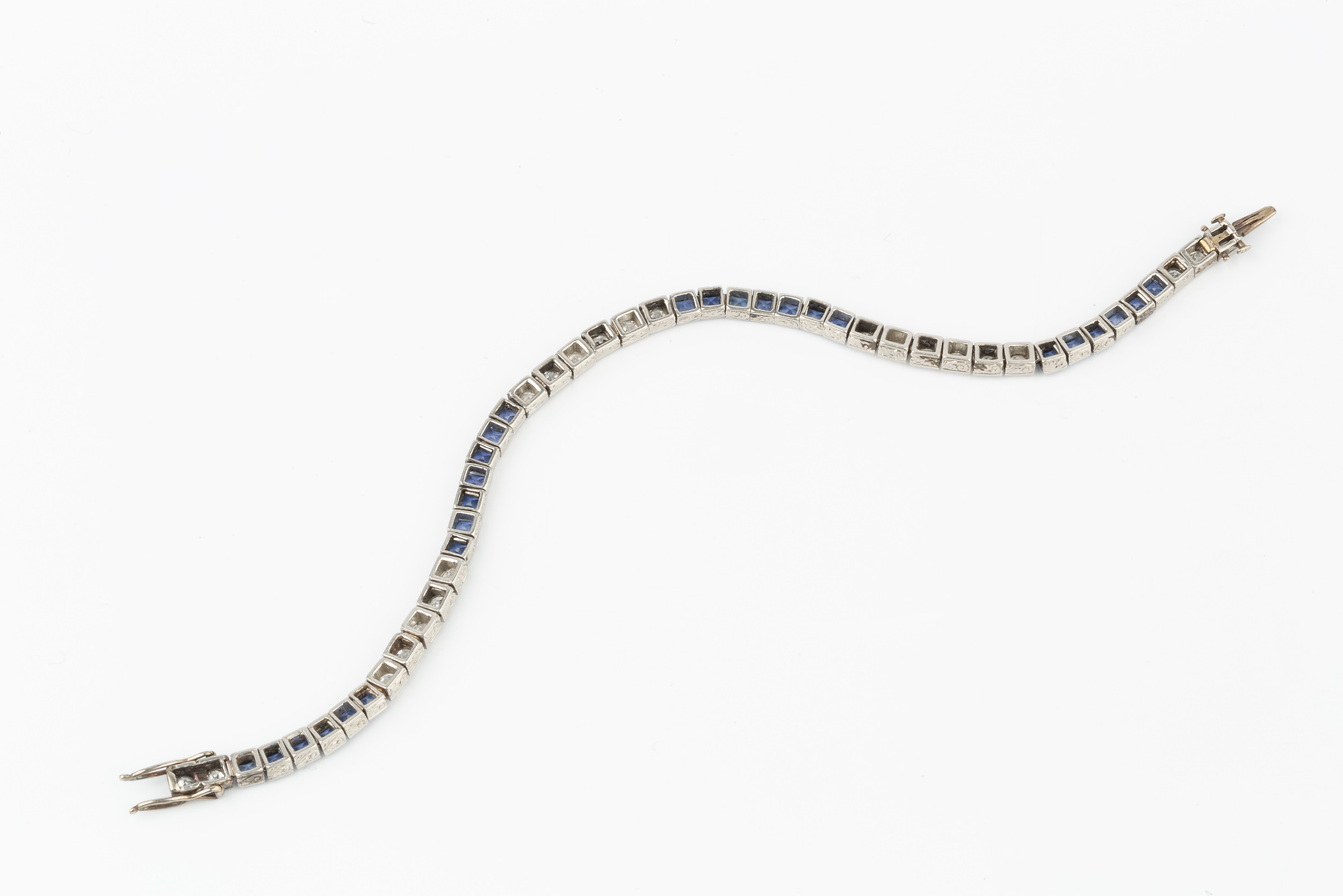 A diamond and sapphire line bracelet, having twenty two diamonds and twenty six sapphires in squared - Image 3 of 3