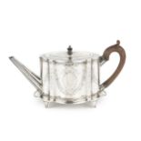 A George III silver teapot, of shaped oval outline, bright-cut with garlands of flowers and having