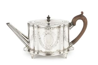 A George III silver teapot, of shaped oval outline, bright-cut with garlands of flowers and having