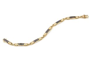 An 18ct yellow gold, sapphire and diamond bracelet, composed of six bowed panels, each set with twin
