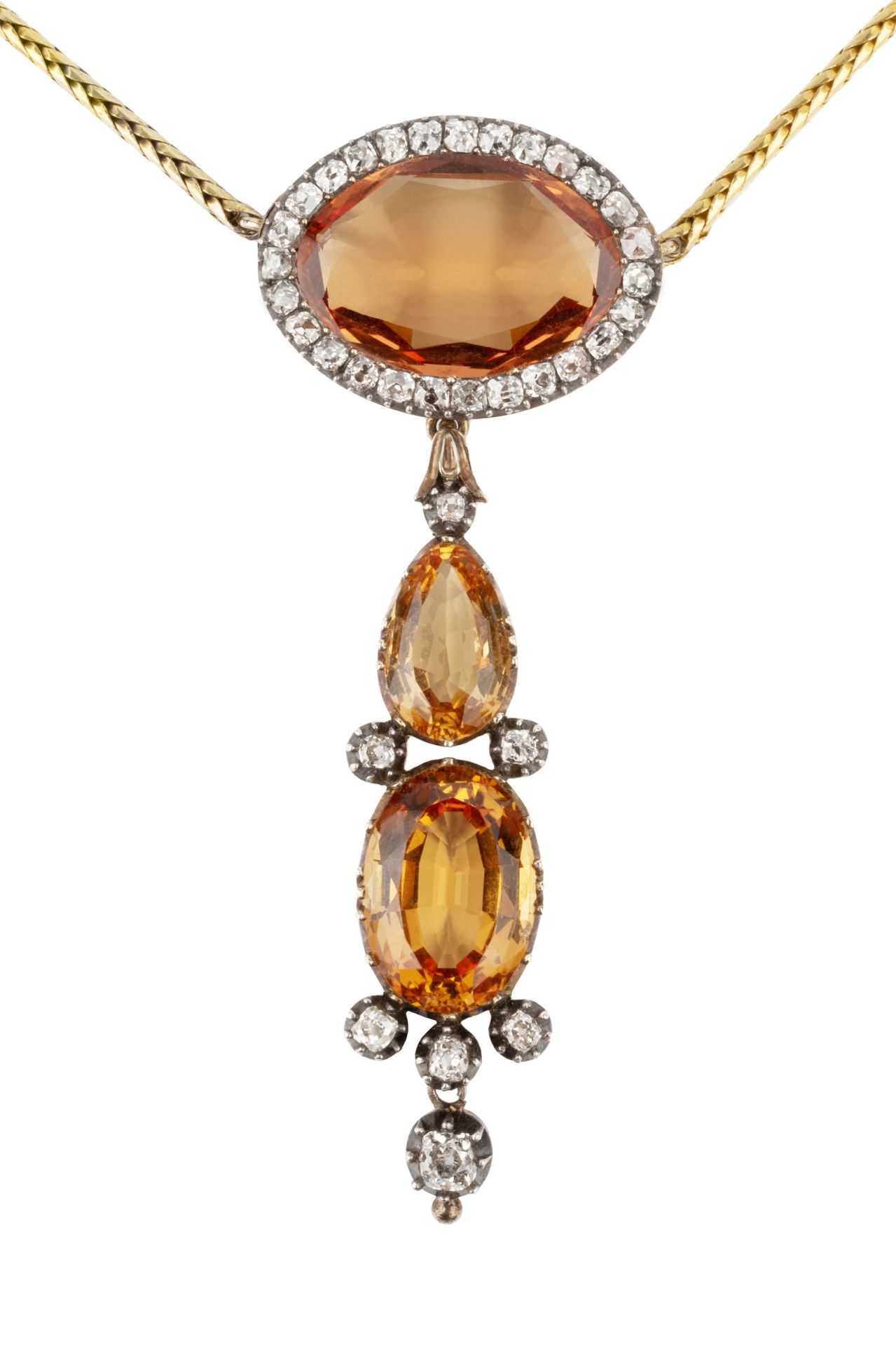 A topaz and diamond pendant, the principal oval stone of orange colour within a border of old cut