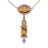 A topaz and diamond pendant, the principal oval stone of orange colour within a border of old cut