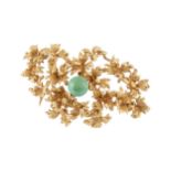 A 15ct gold and turquoise brooch, centred with a turquoise sphere within a surround of