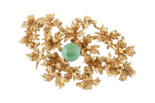 A 15ct gold and turquoise brooch, centred with a turquoise sphere within a surround of