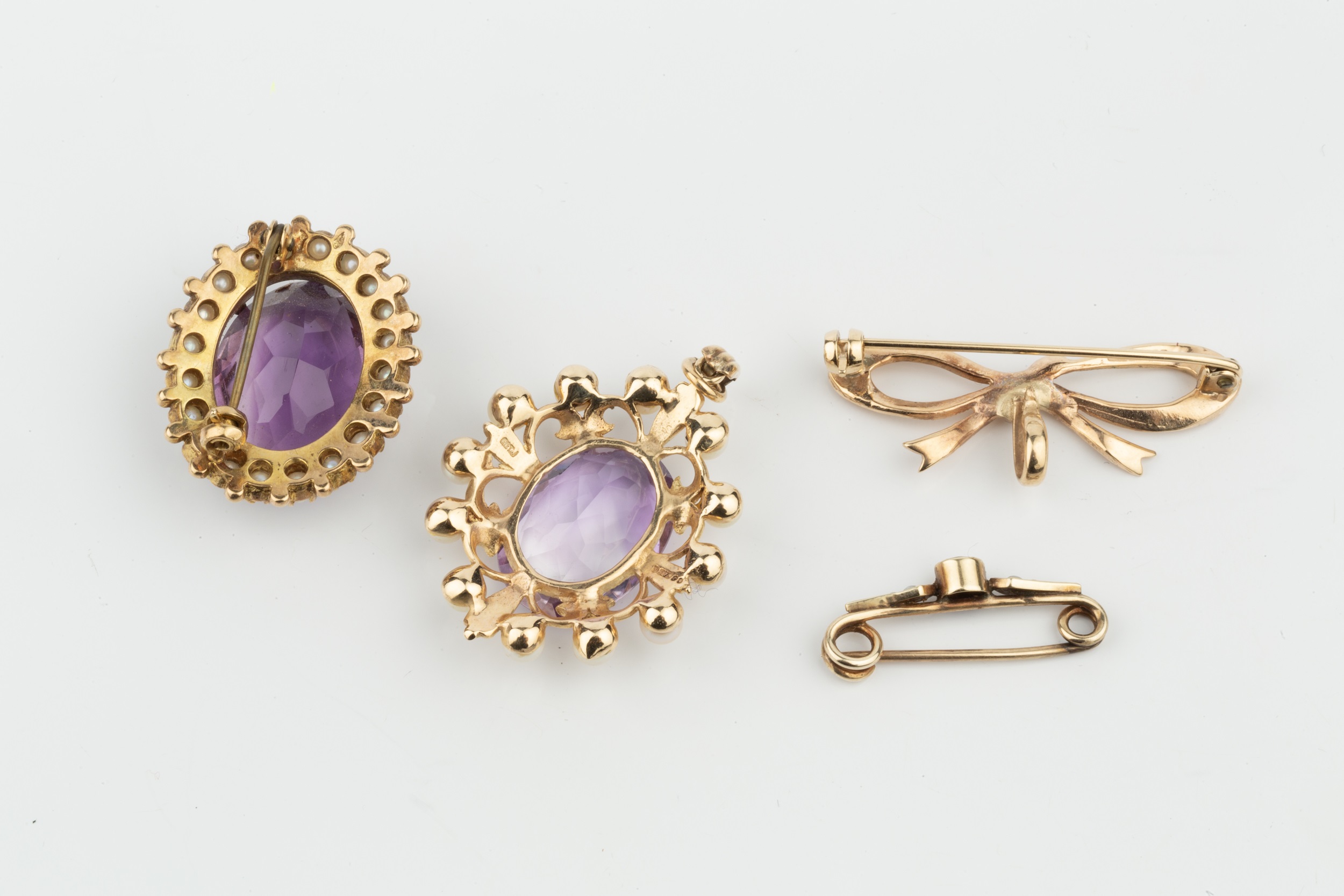An amethyst and cultured pearl oval pendant, the oval cut amethyst set in 9ct gold with a border - Image 2 of 2