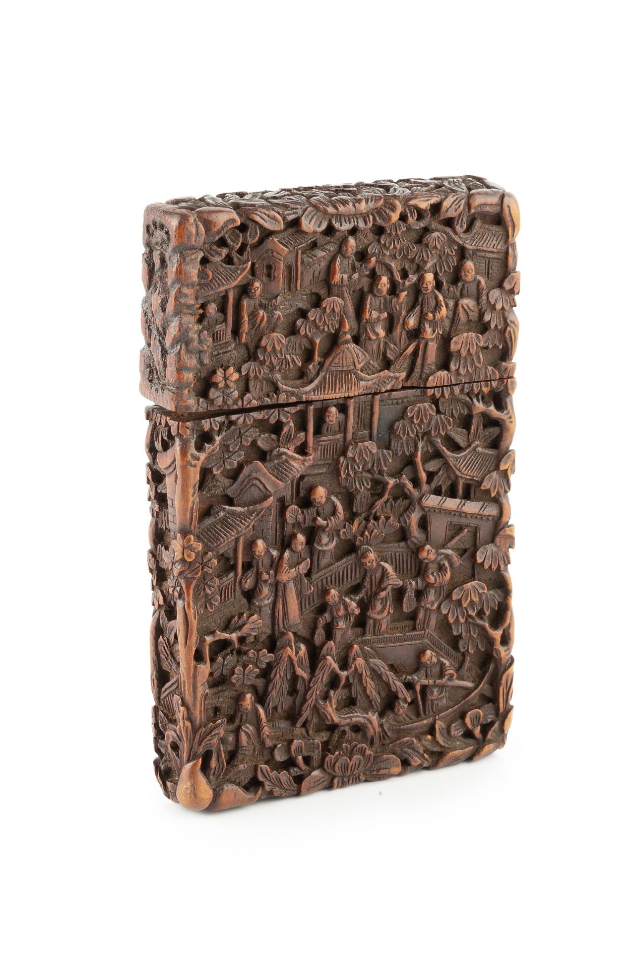 A 19th century Chinese export carved hardwood card case, intricately carved with figures amidst