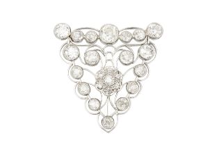 A diamond cluster brooch, millegrain set with eighteen old cut stones in a scrolling open triangular