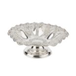 A late Victorian silver pedestal dish, with pierced and embossed decoration, and later