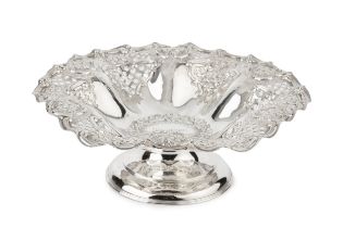 A late Victorian silver pedestal dish, with pierced and embossed decoration, and later