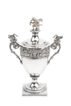 A 19th century Italian (Papal States) silver urn and cover, with kneeling cherub and serpent finial,