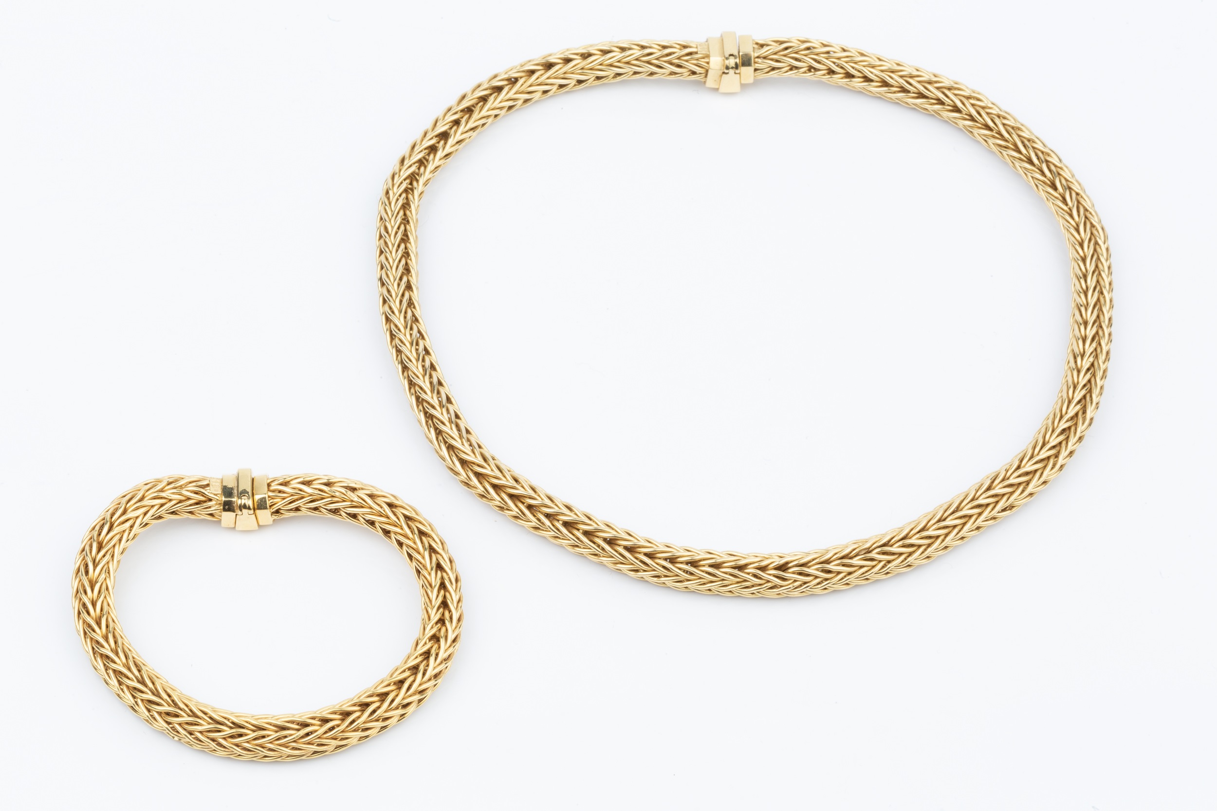 An 18ct gold ropetwist necklace, and matching bracelet, with flexible herringbone links and - Image 2 of 2
