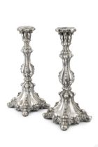 A pair of 19th century German silver candlesticks, of knopped and lobed form, with embossed