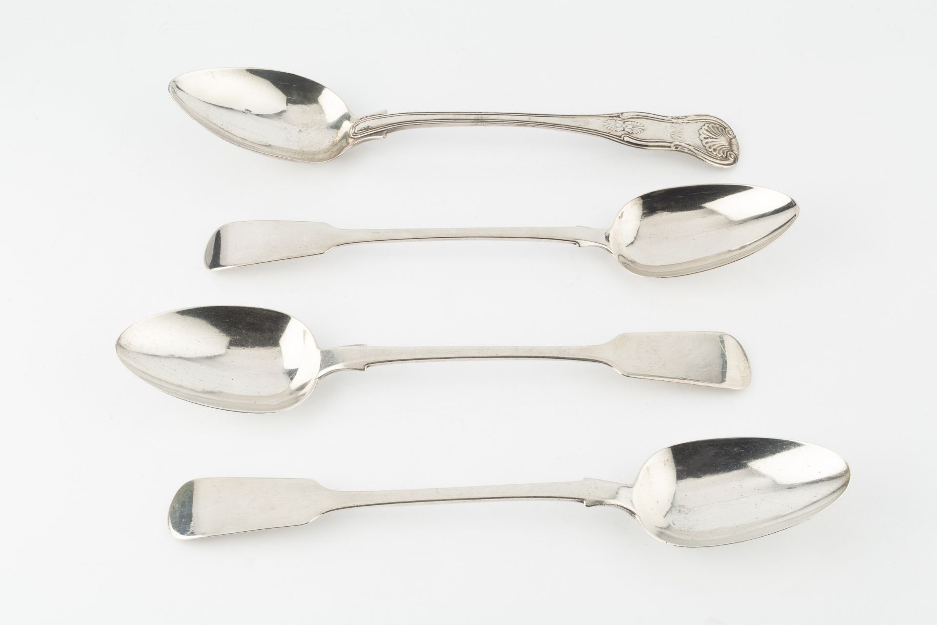 A George IV silver King's pattern gravy spoon, by William Troby, Londonn 1822, a pair of William