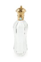A 19th century French gold mounted glass scent bottle, of waisted and faceted form, the hinged cover