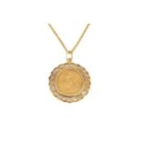 An Edward VII half sovereign, 1909, with later 9ct gold scroll pendant mount and fine trace link