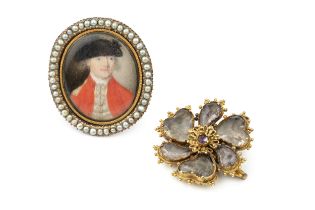 An early 19th century oval brooch, the glazed panel depicting a portrait of a young officer in