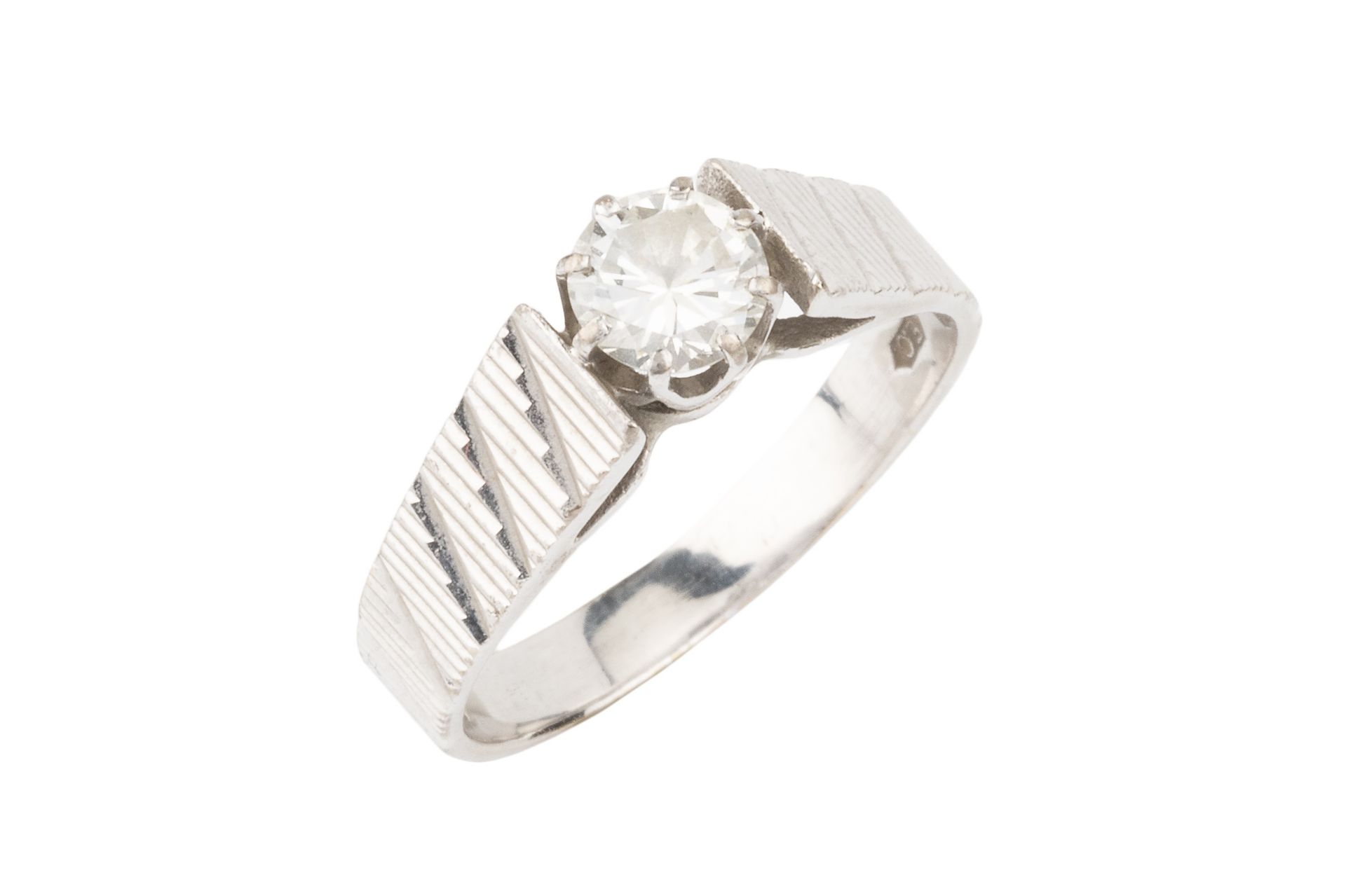 A diamond solitaire ring, the brilliant cut stone of approx 0.5ct, claw set to a textured 18ct white