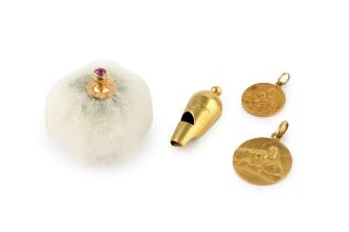 A 19th century yellow metal whistle, engraved with a pair of lovebirds and with split pearl inset