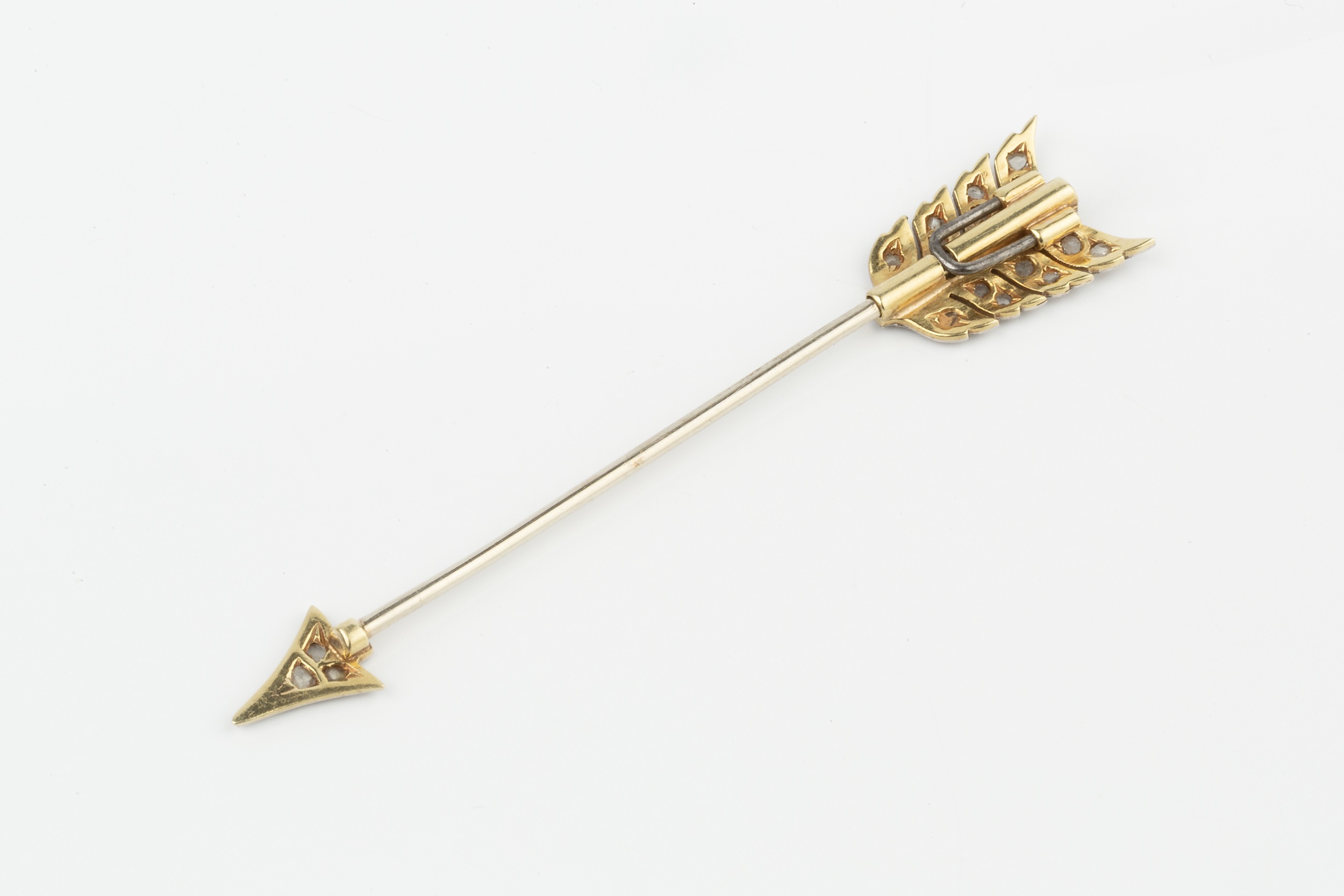 A diamond set jabot pin, in the form of an arrow, the tip and flight set with rose cut stones, 5.8cm - Image 2 of 2