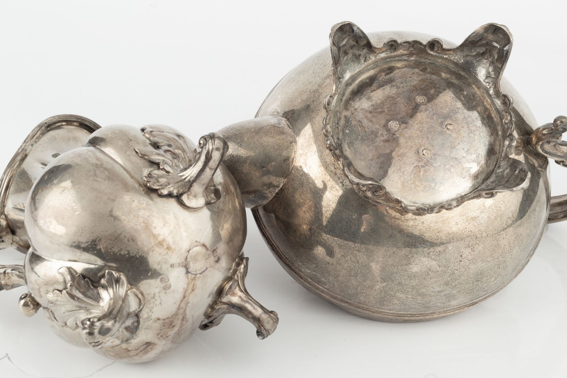 An early Victorian silver teapot, with reeded compressed body, foliate capped spout and floral - Image 2 of 2