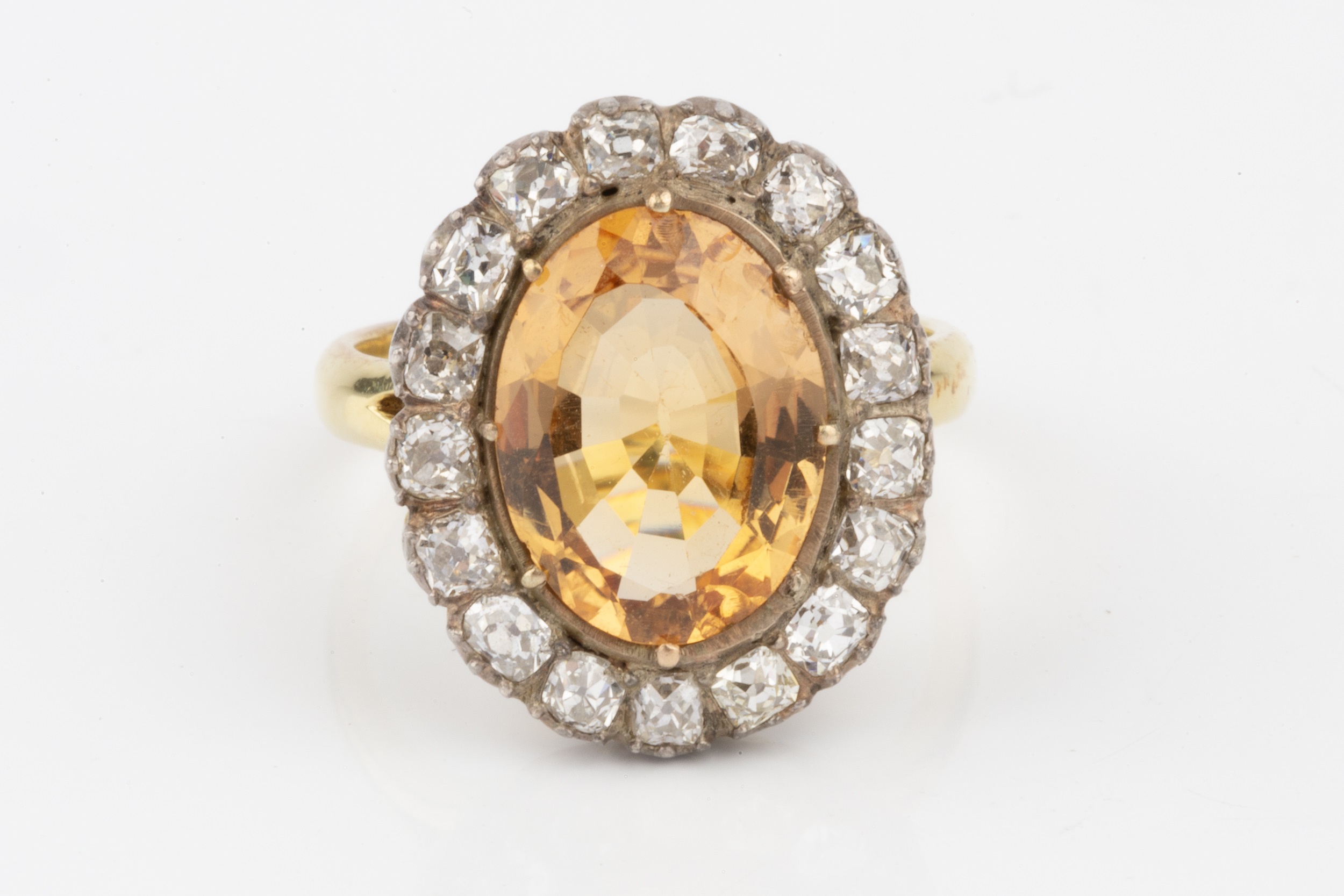 A topaz and diamond cluster ring, the oval central orange-brown topaz within a border of seventeen - Image 3 of 8