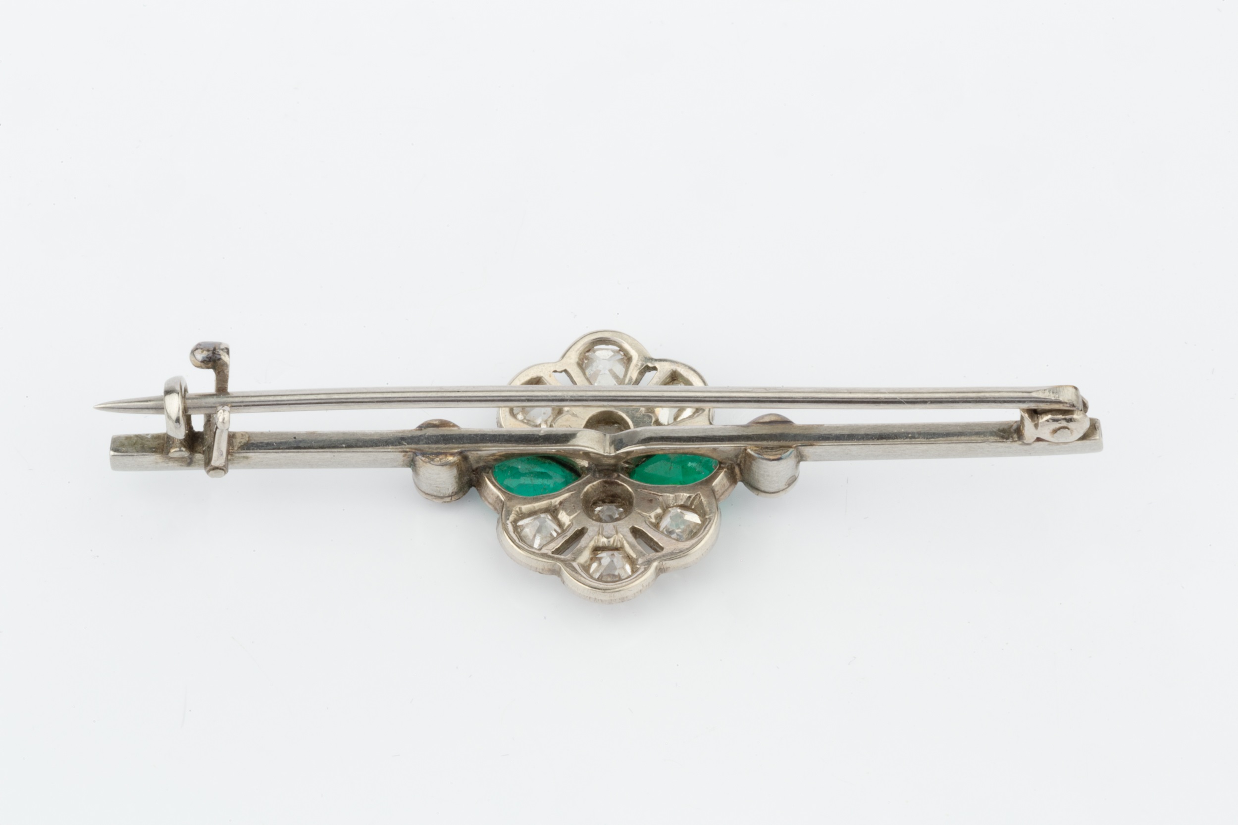 An emerald and diamond cluster bar brooch, the uniform bar centred with a pierced and millegrained - Image 6 of 6