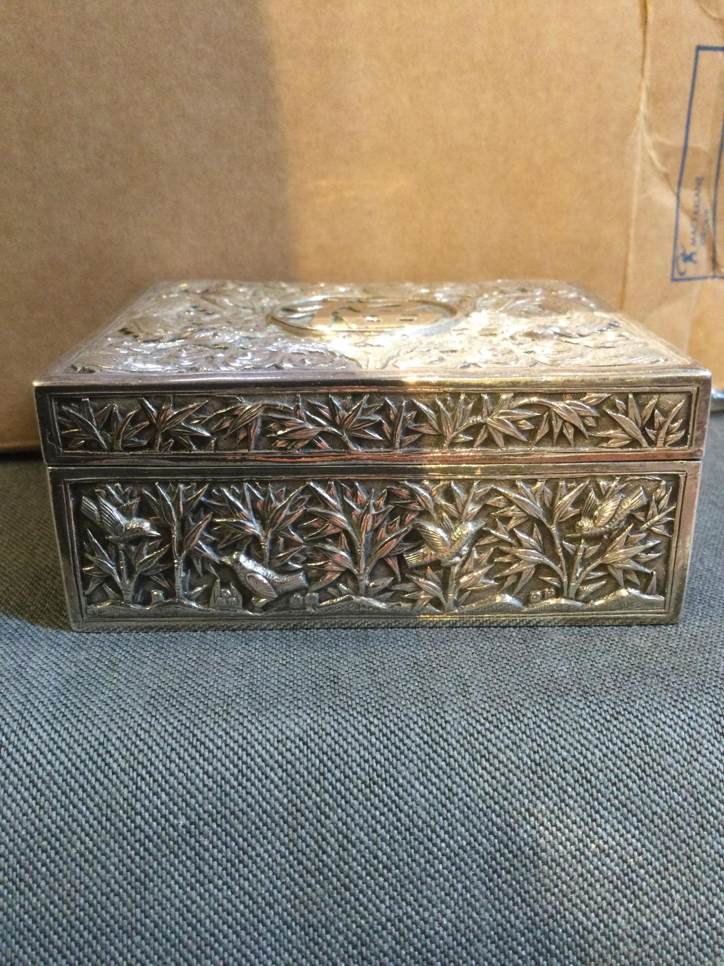 A Chinese silver rectangular box, with hinged cover, embossed and engraved with dragons amidst - Image 8 of 10